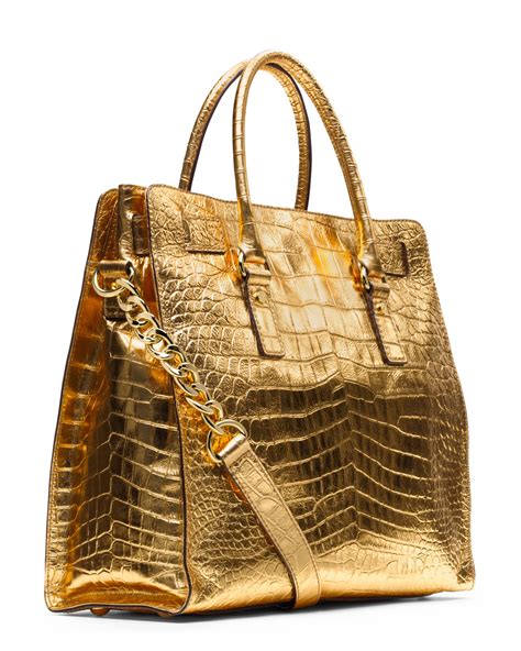 gold handbag michael kors|Michael Kors large gold tote.